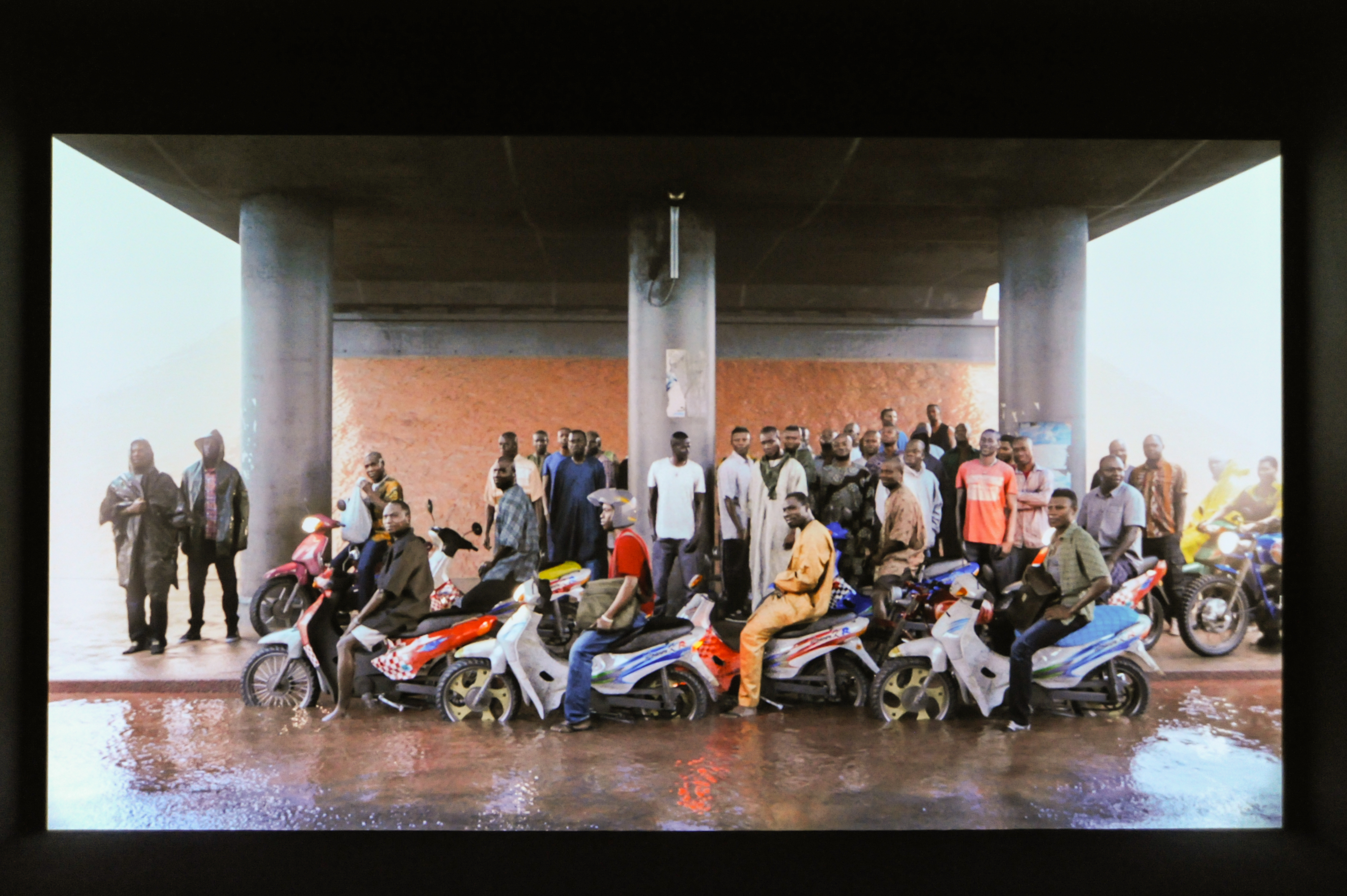 Oil workers (from the Shell company of Nigeria) returning home from work, caught in torrential rain Image